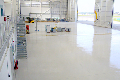 What Are the Main Considerations When Selecting a Floor Coating Material for Commercial and Military Aircraft Hangar Facilities